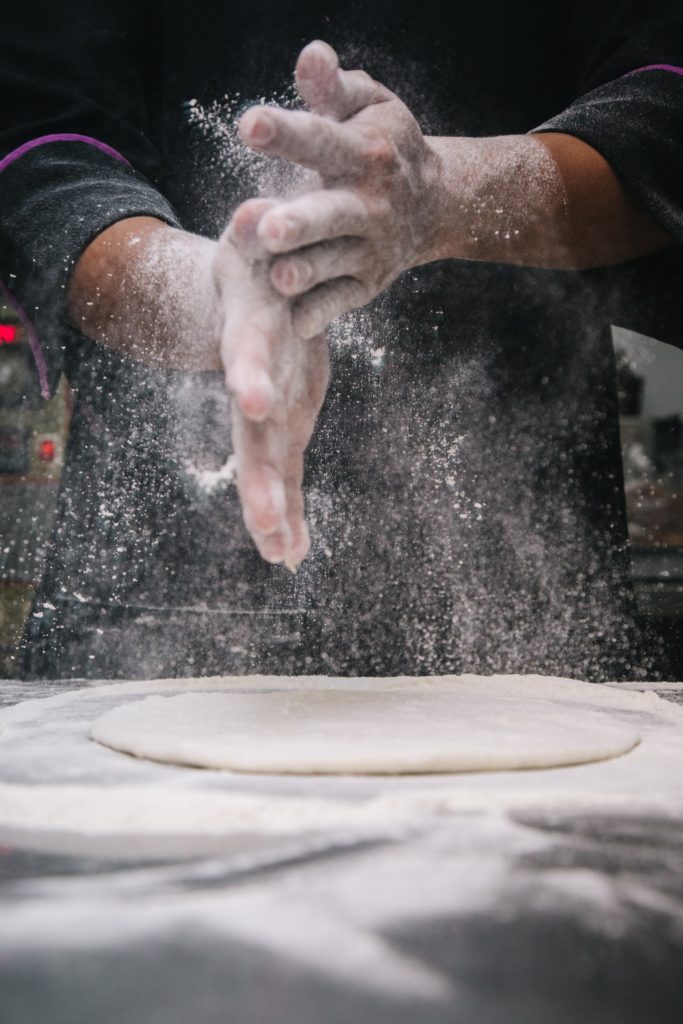 baker's hands with flour